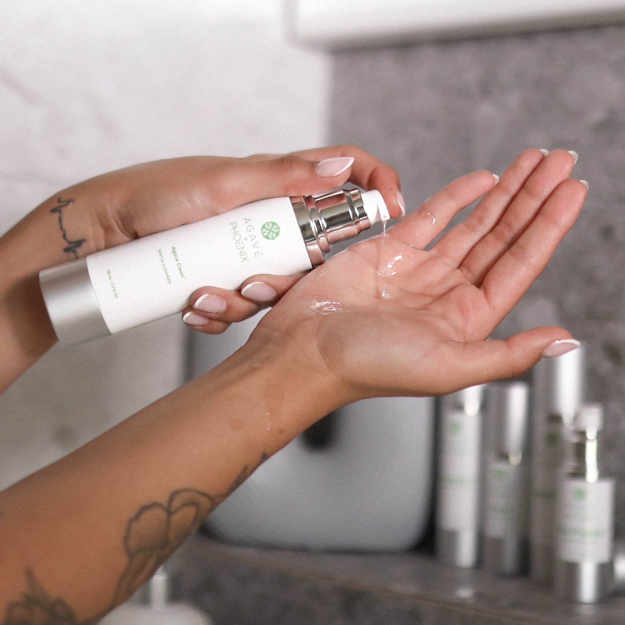 Agave Clean gentle exfoliating cleanser shown on hand — formula for balanced, refreshed skin.